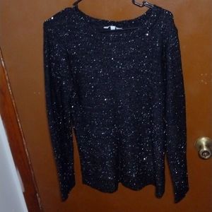 Women Large Black Glitter sweater with tie down going down the back.